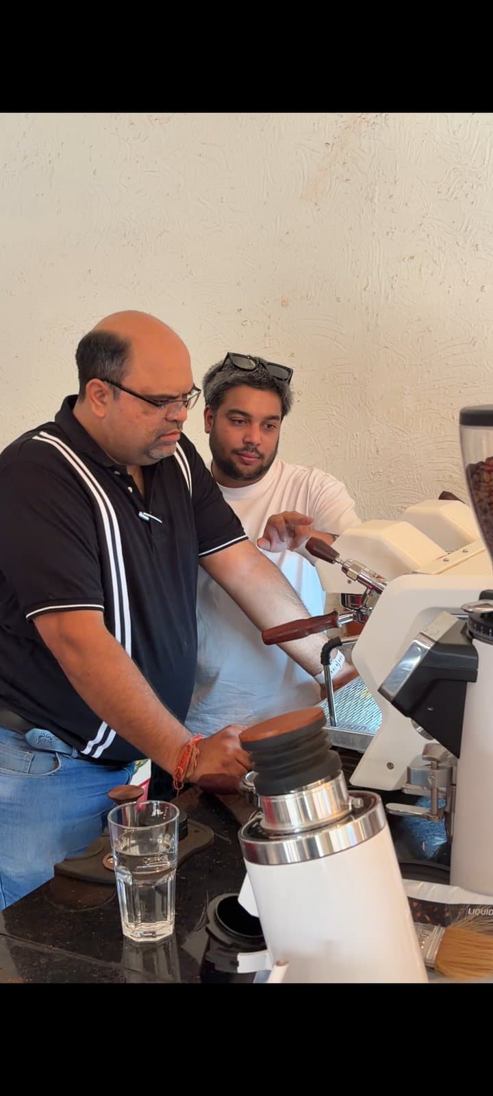 A 1DM bar takeover — Akhand hosting Handcrafted's owner and their coffee behind our counter, one of many guest takeovers we've run.